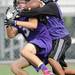 Pioneer High School players reach for a pass during the first day of practice on Monday, August 12, 2013. Melanie Maxwell | AnnArbor.com